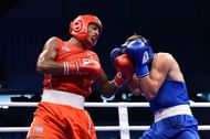 Iribar of Cuba in Red got Popov of Russia flush on the face with a left Uppercut (Image Courtesy: AIBA)